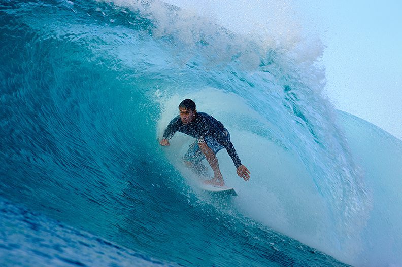 Traditional surfer in the barrel 